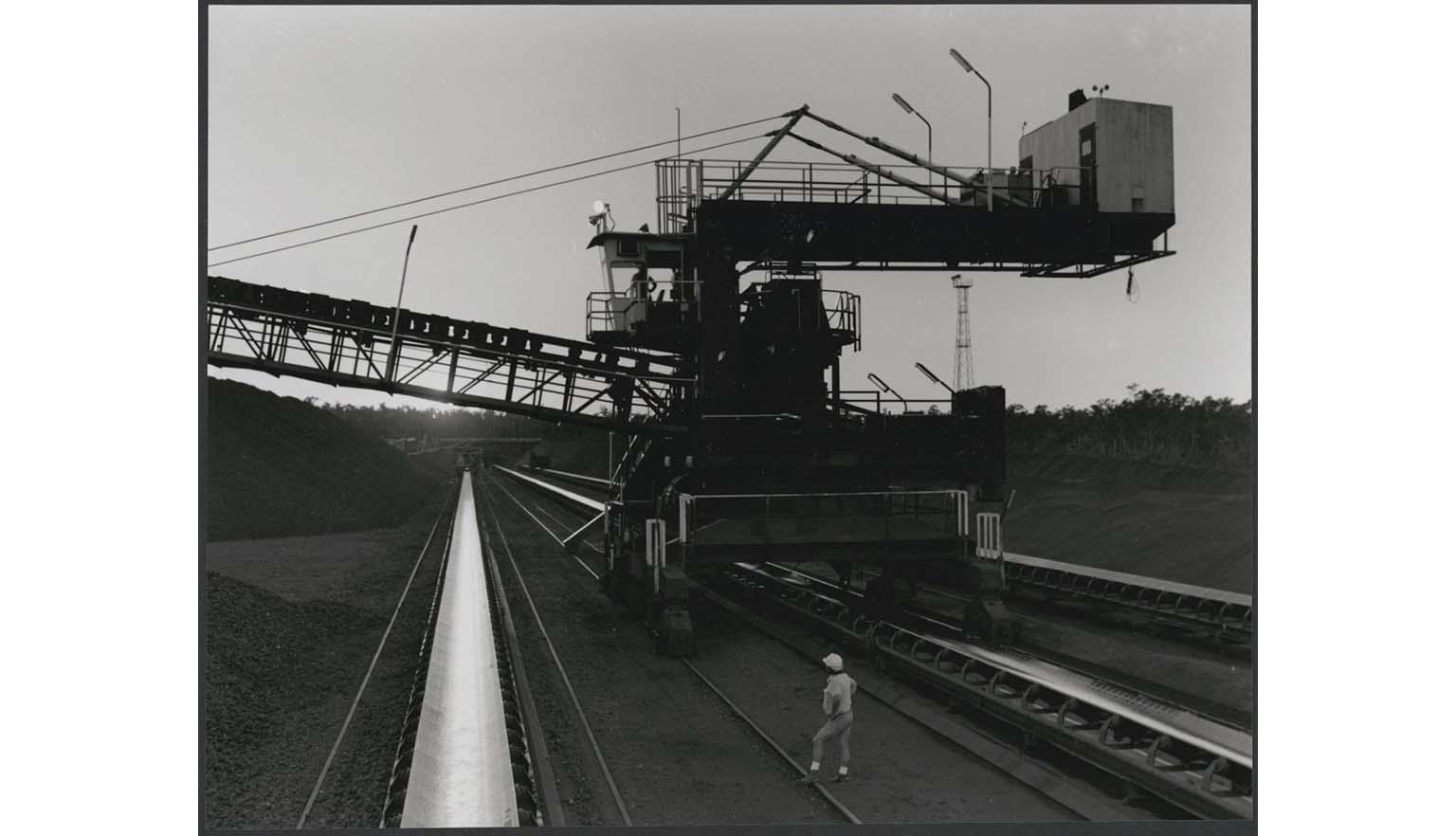 man next to stacker reclaimer