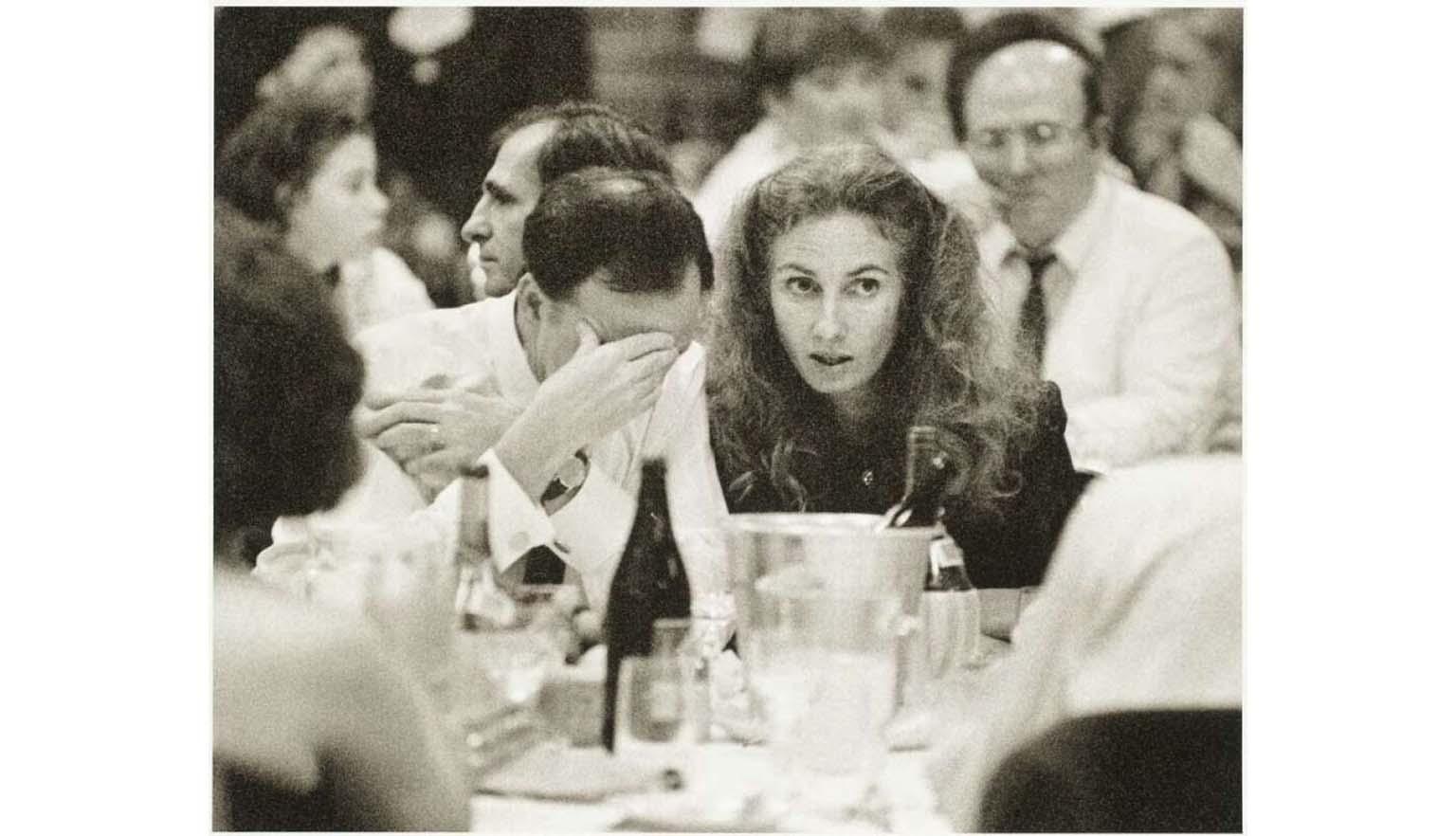black and white photograph of couple seated at table