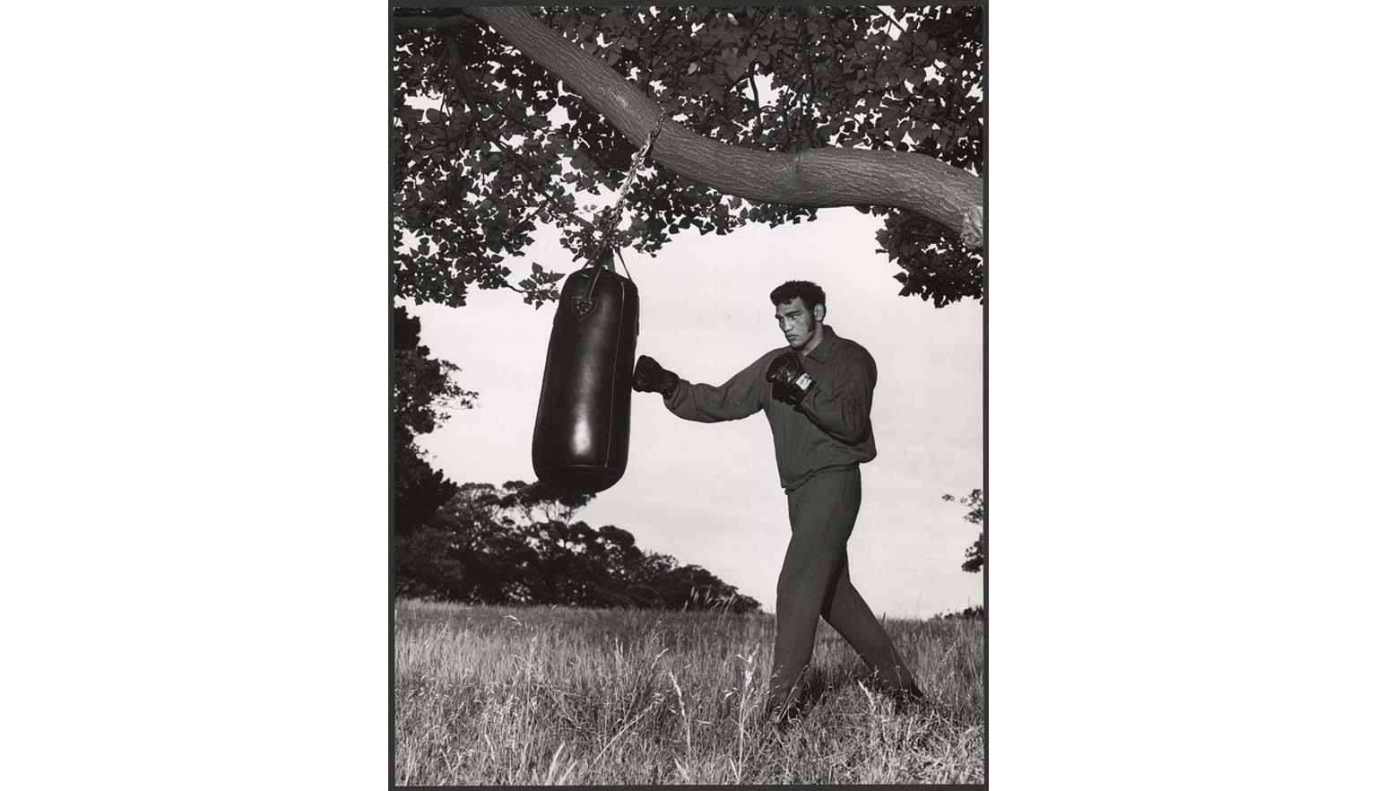 Black and white photo of Tony Mundine training in Centennial Park, Sydney