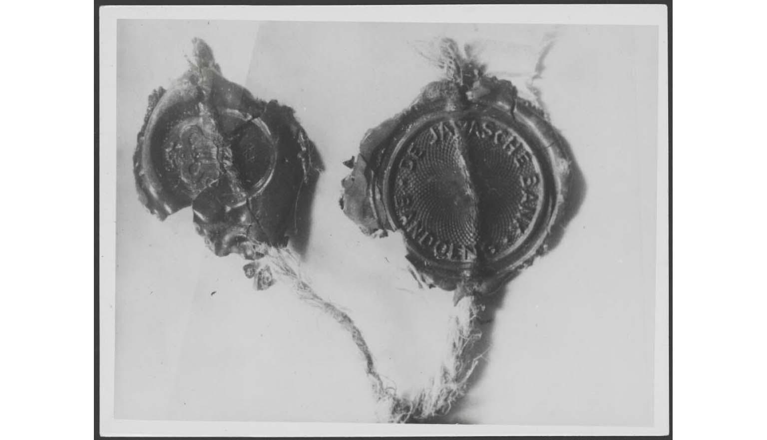 black and white photograph of a wax seal from a Dutch bank