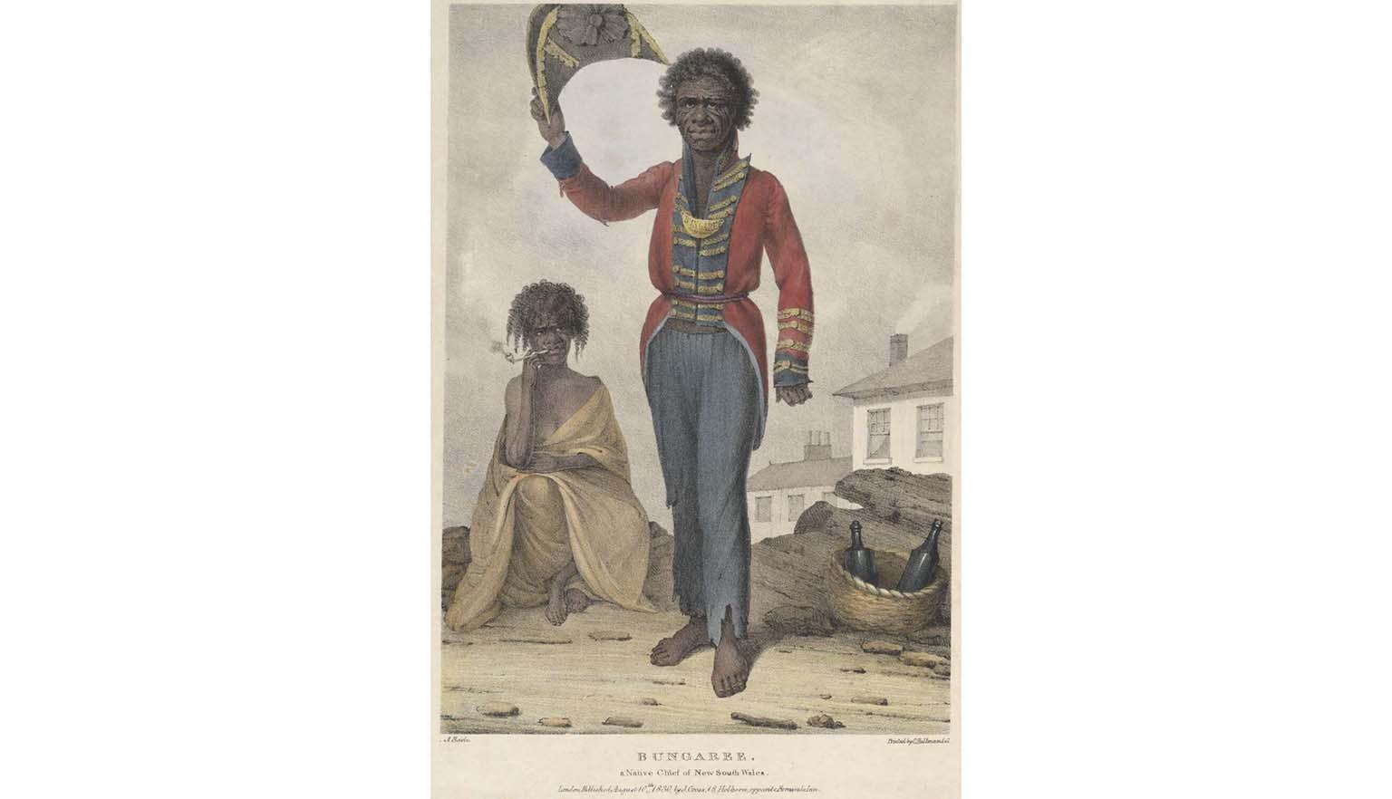 A portrait of a man. He has dark skin and hair. He is an Australian Indigenous man and is wearing a red, blue and gold European style officers coat and trousers. His trousers are tattered at the cuffs. He is holding a tricorn hat in the air. In the background an Indigenous women is seated, wrapped in a shawl. She is smoking a pipe. There is a woven basket with two empty bottles. In the background there is a white washed house with smoke curling from the chimney.