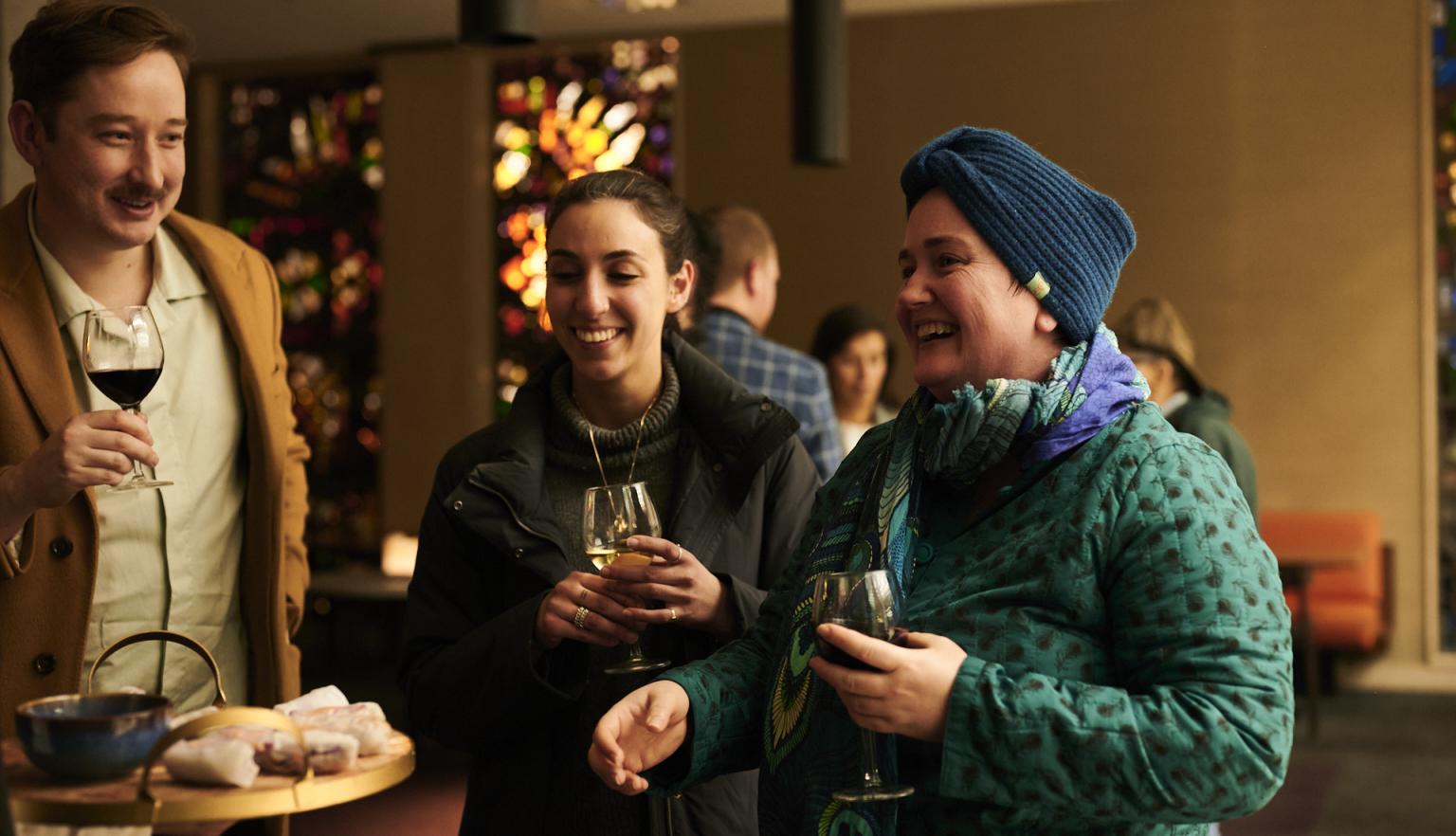Bookplate guests enjoying a drink