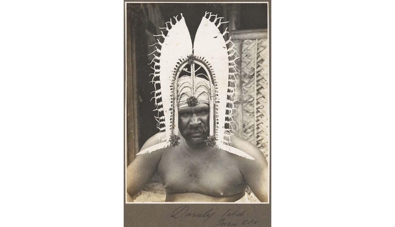 photo of a man wearing an islander head dress