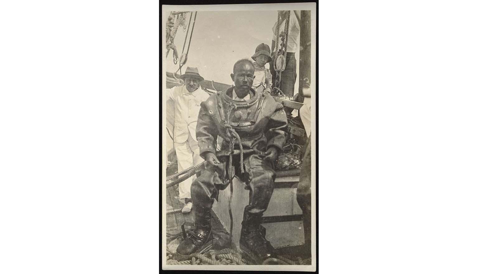 photo of a man in pearl diving gear