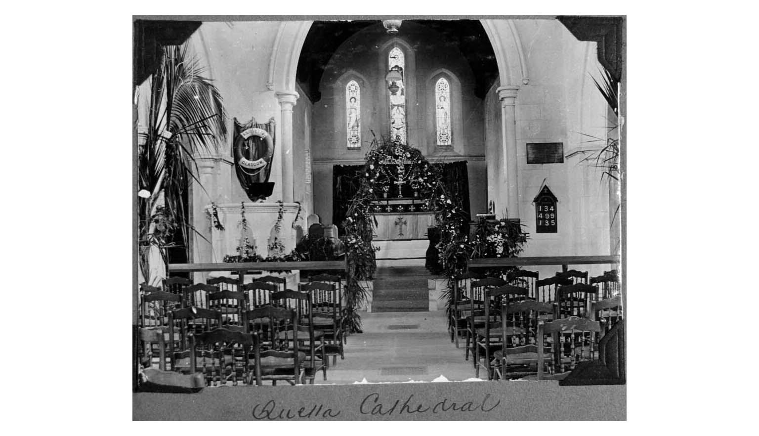 black and white photo of the inside of a cathedral