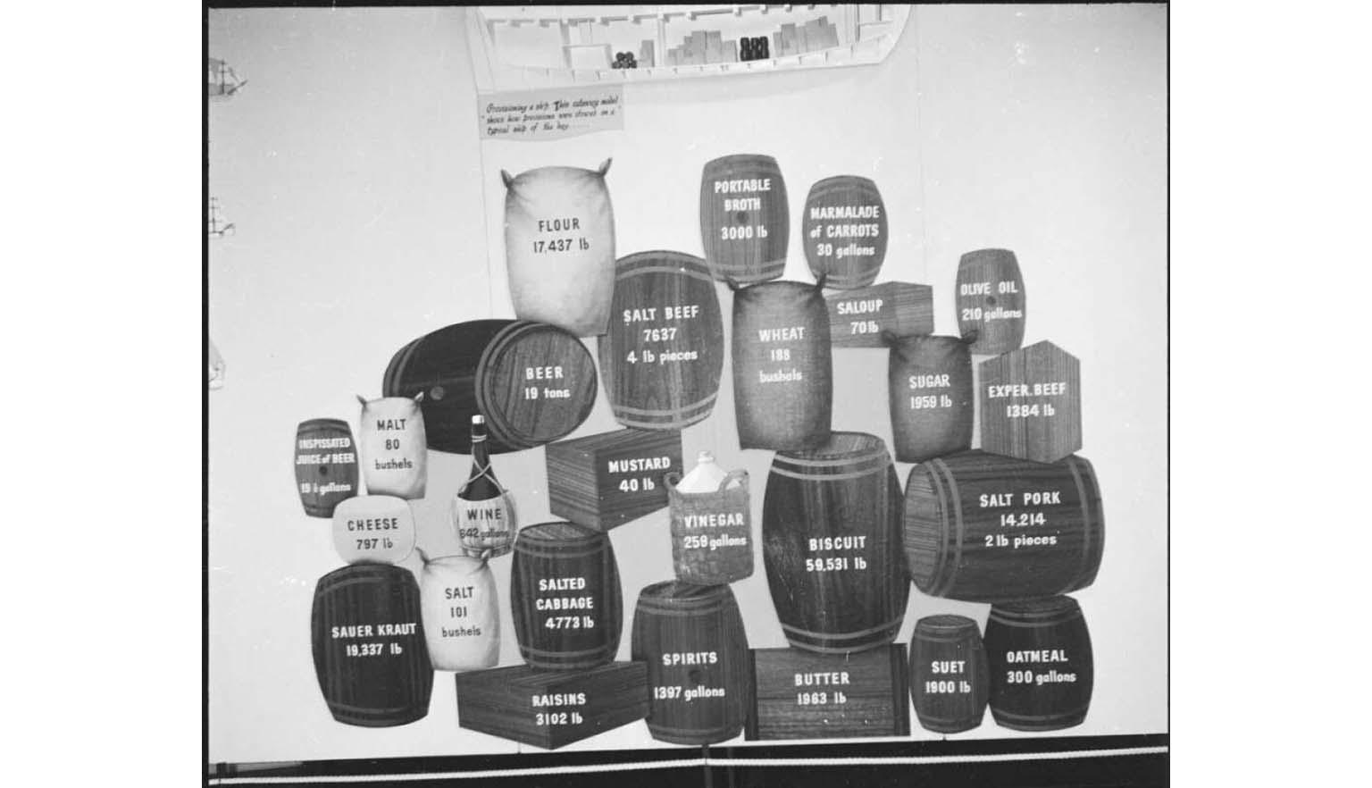 photograph of different sized barrels labelled with various foodstuffs