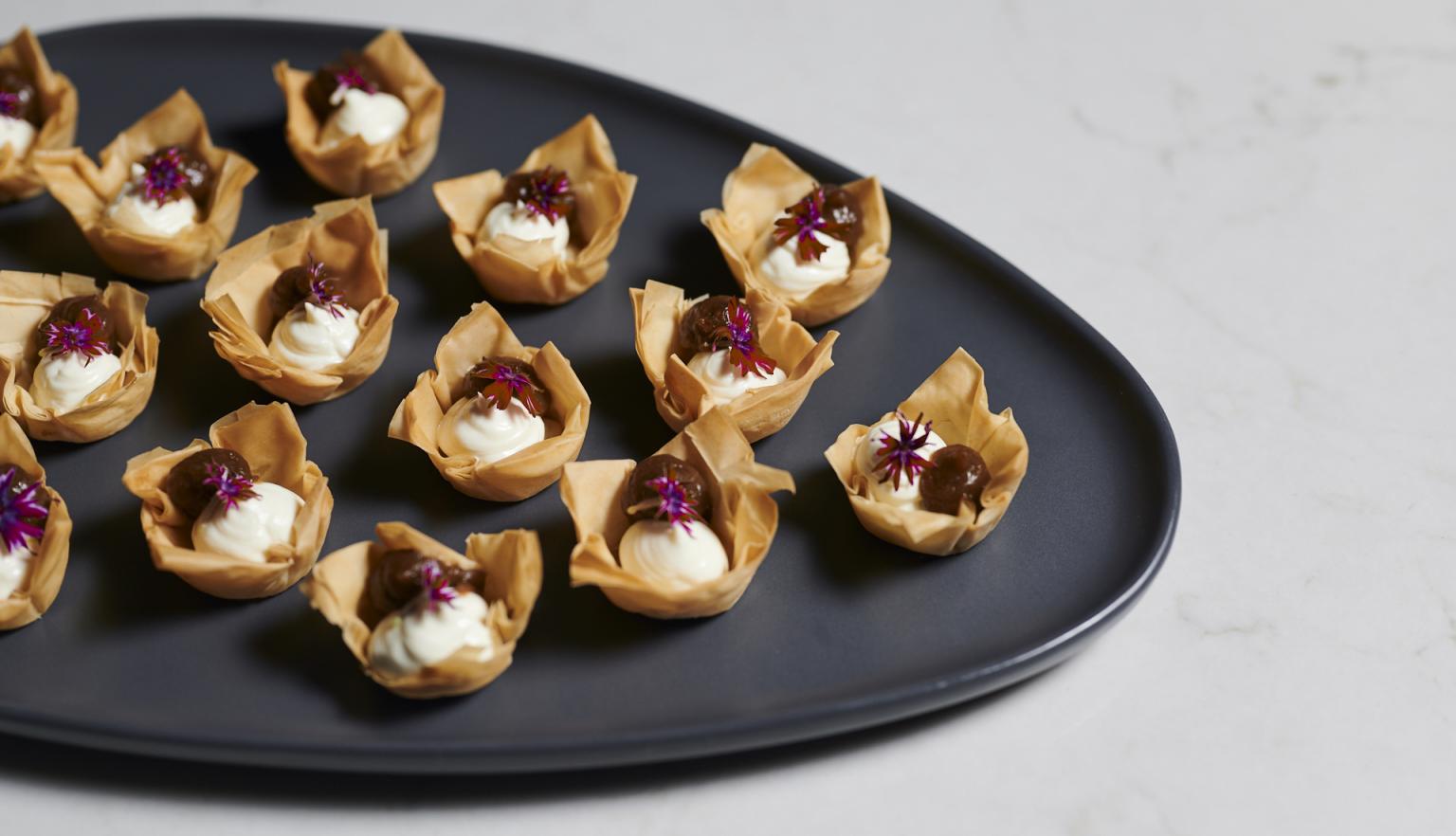 Catering plate set up with tasty pastry bites