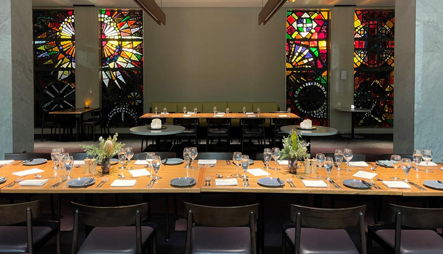 Bookplate set up for a dinner event with a long table all set up