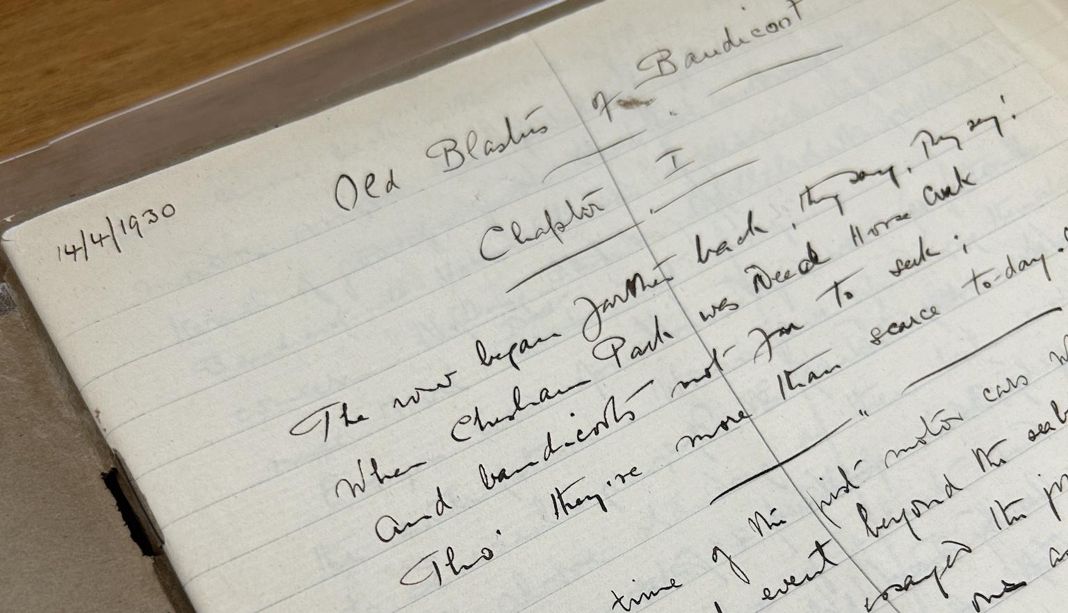 An open notebook with handwritten text in black ink