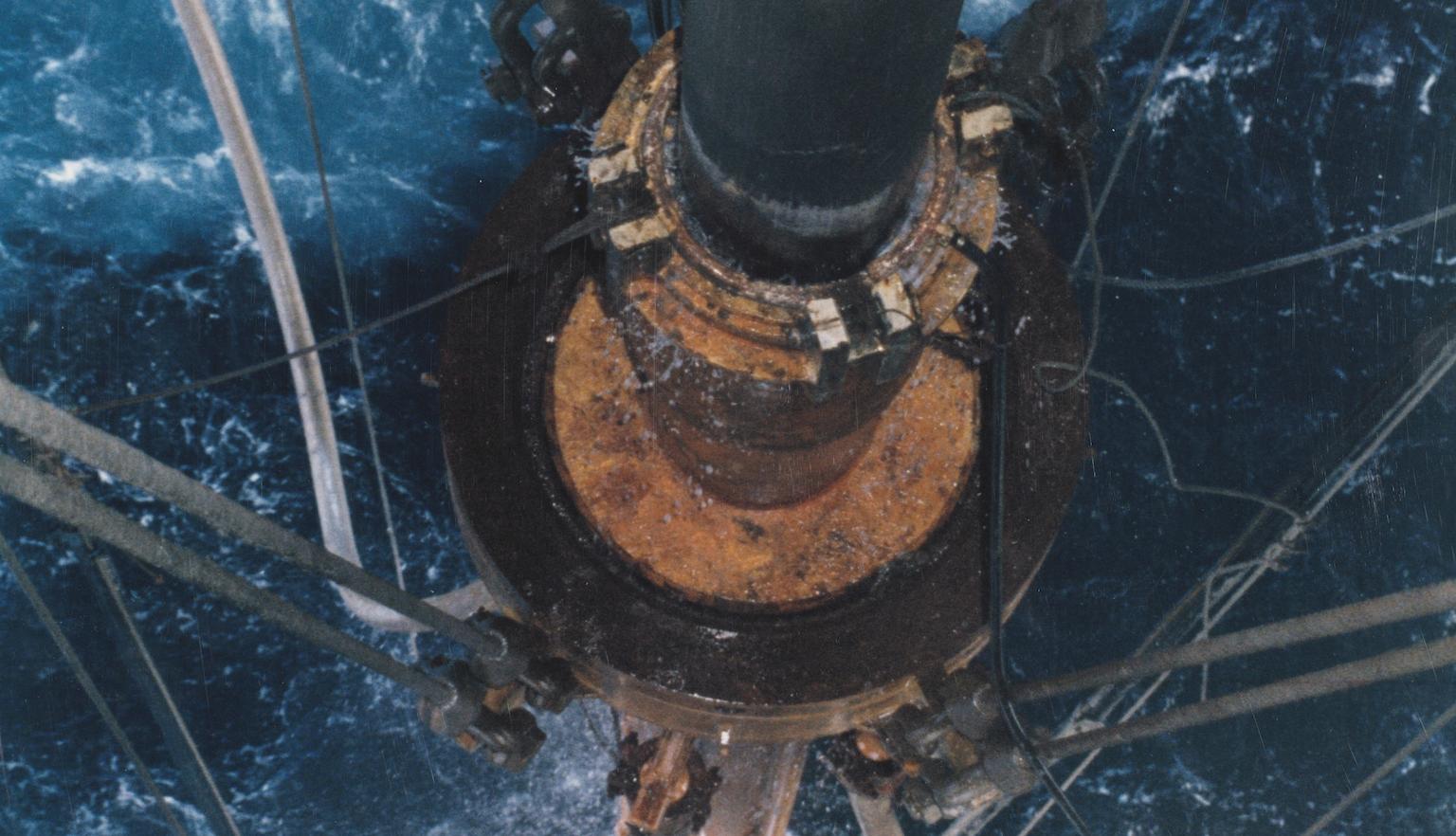Oil rig drilling in the ocean viewed from above