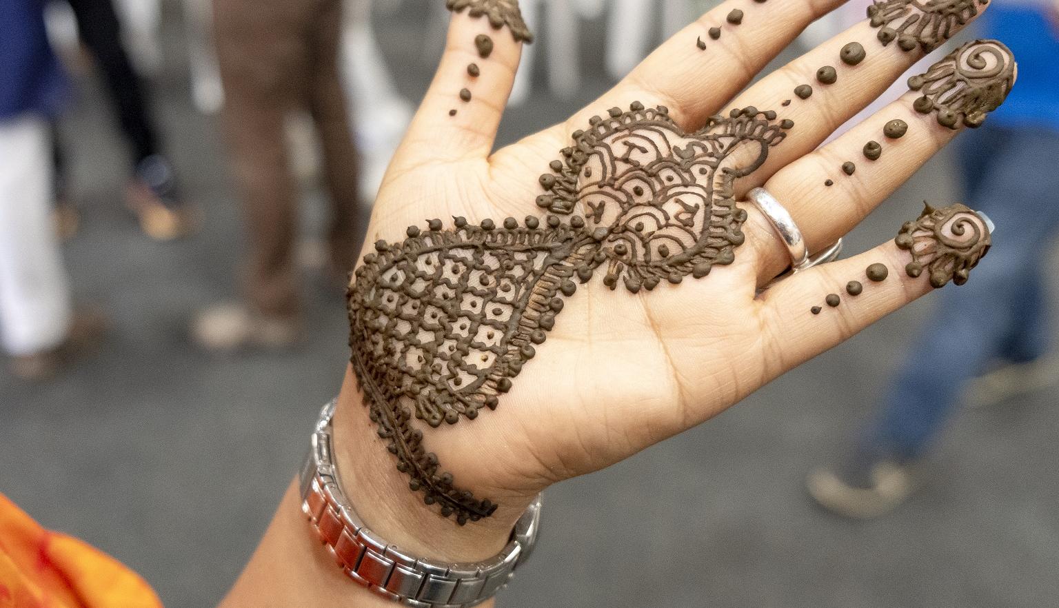 Woman's hand decorated with Mehndi
