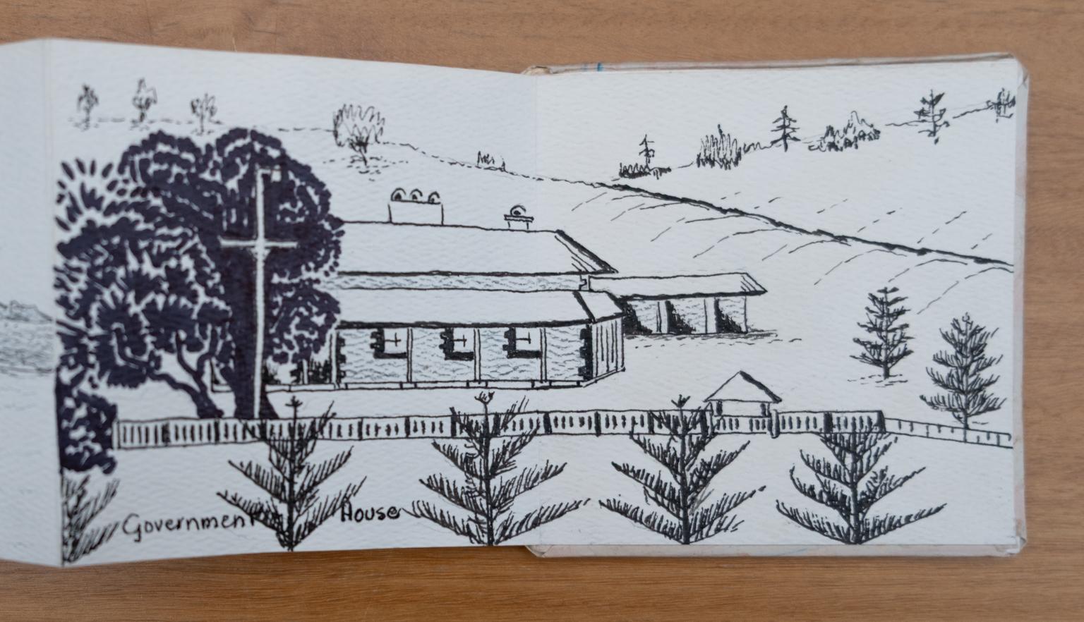 Fold-out travel diary open to four pages with black and white illustrations of a house surrounded by trees labelled 'Government House'