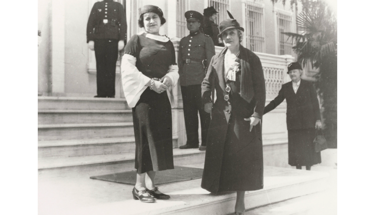 Black and white photo of Bessie Rischbieth and Ruby Rich standing on the steps in front of a building