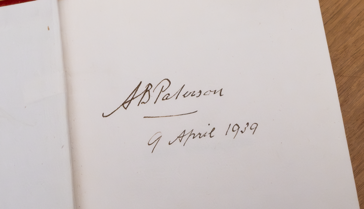 Handwritten signature of Andrew Barton (Banjo) Paterson, with a date, on a blank page in one of his books