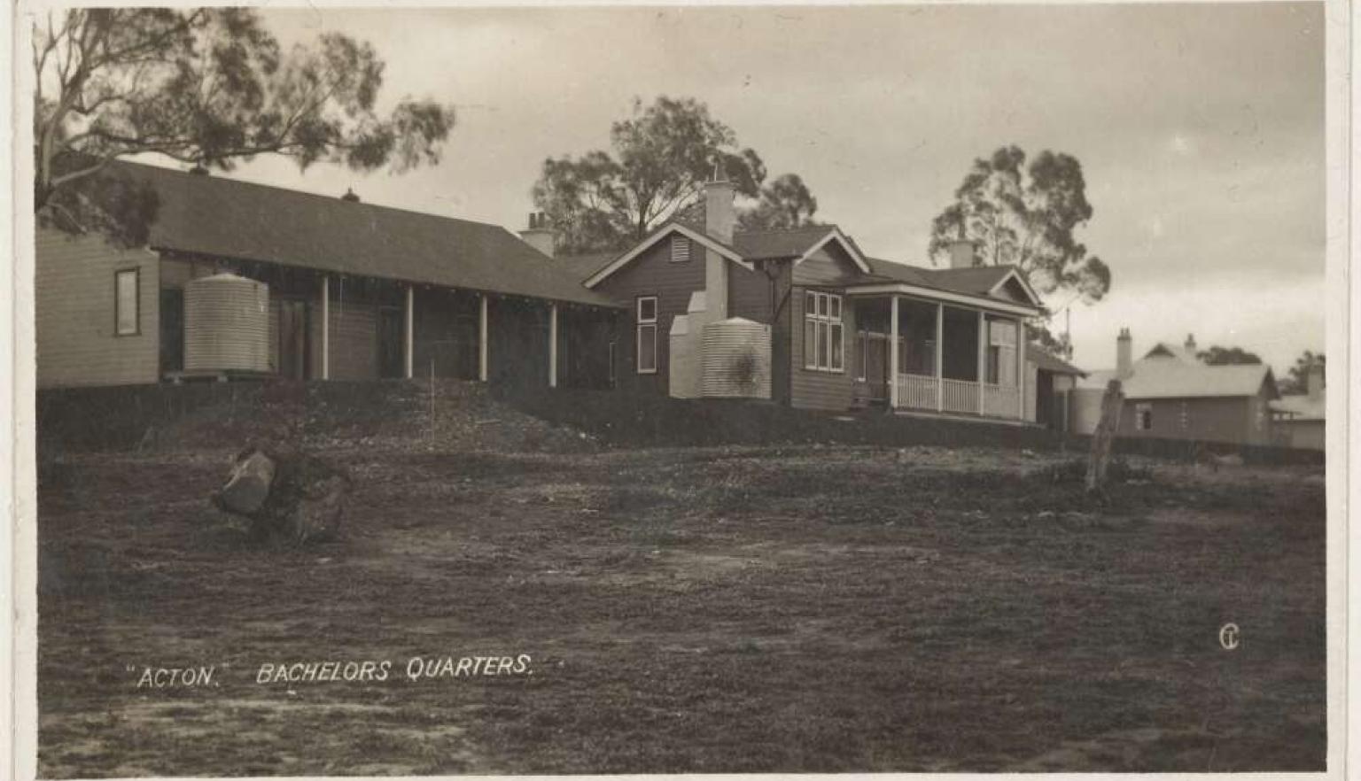 A black and white image of house. on the image the inscription reads "ACTION" BCHELORS QUARTERS