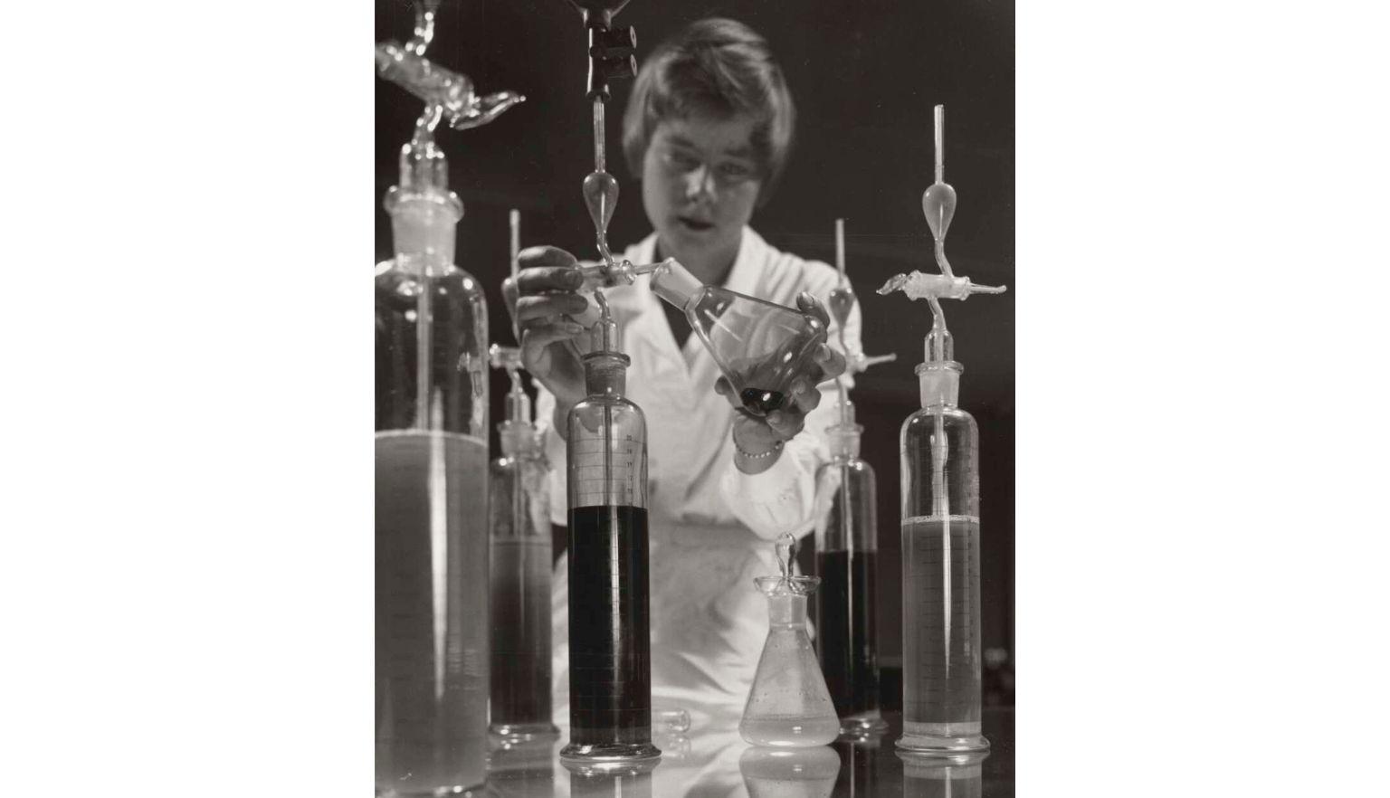 A woman with chemistry equipment 