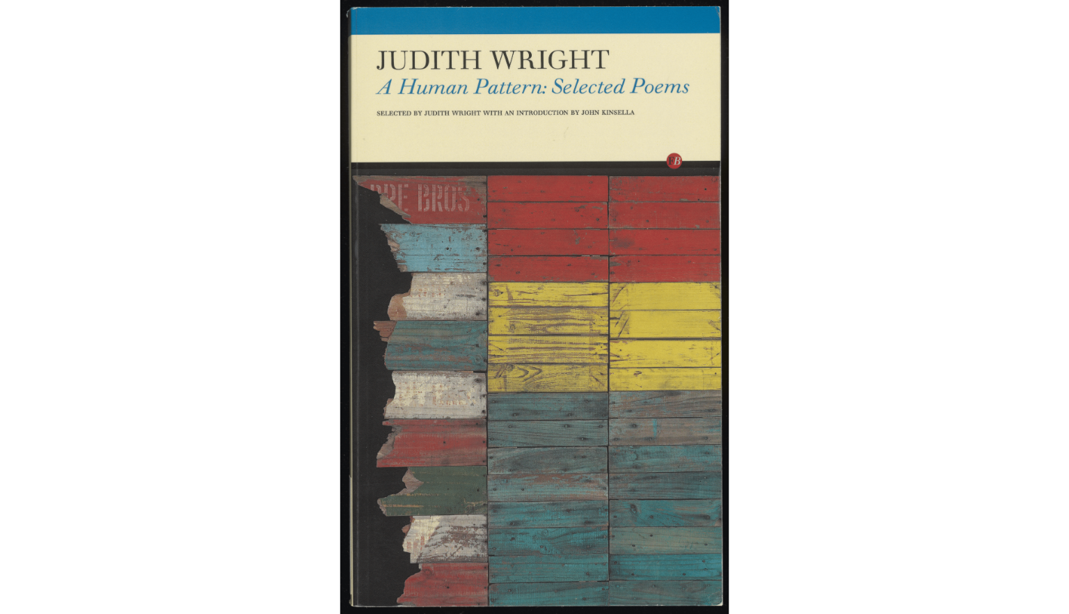 Book cover titled at the top 'A Human Pattern: Selected Poem', below title are panels of colourful wood