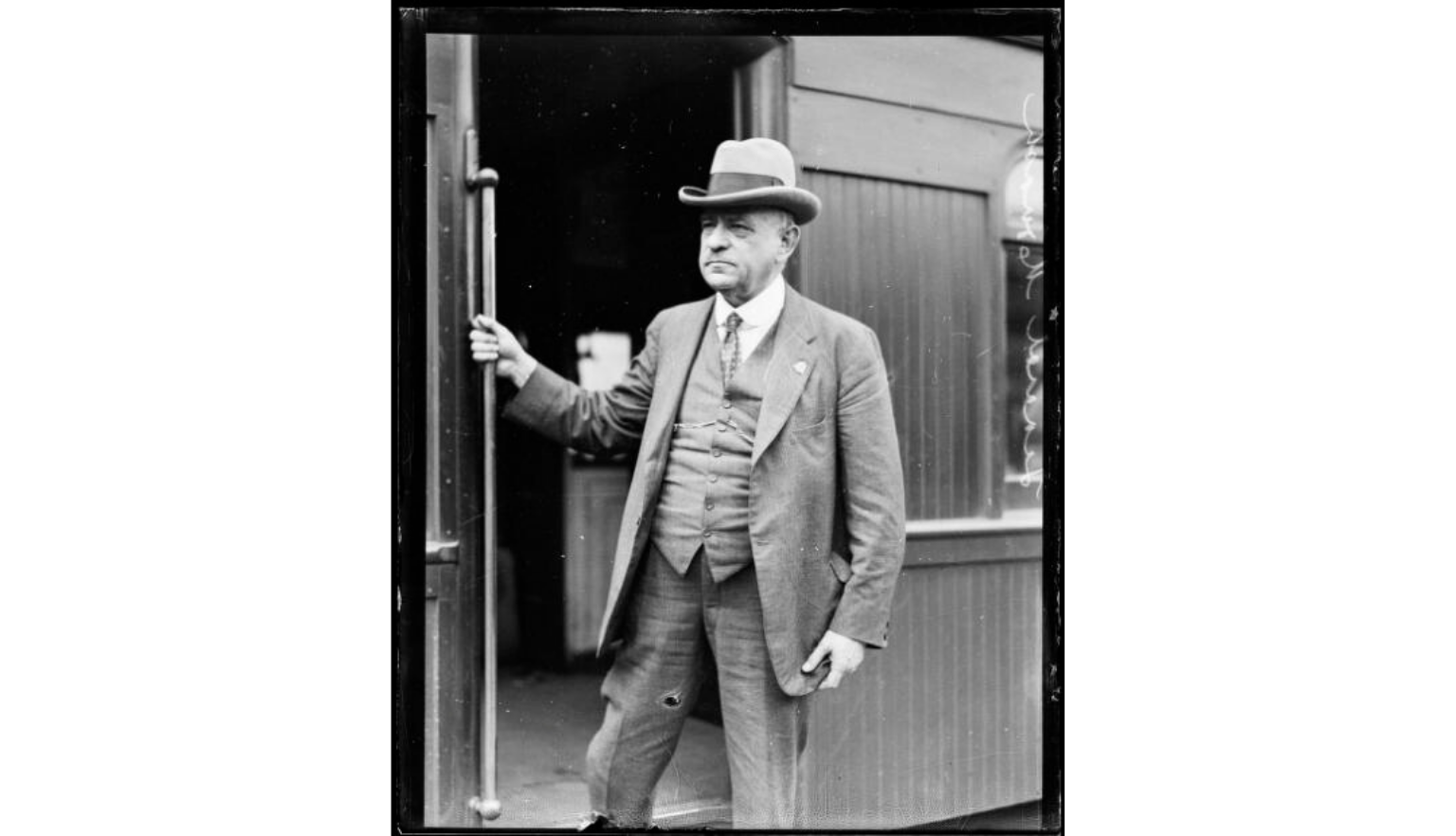 Black and white image of Sir John Monash stepping off a train