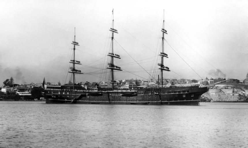 Black and white photo of a large ship in a harbour