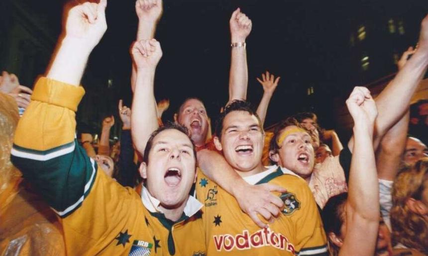 Three friends watch Rugby World Cup 2003 from the Rocks