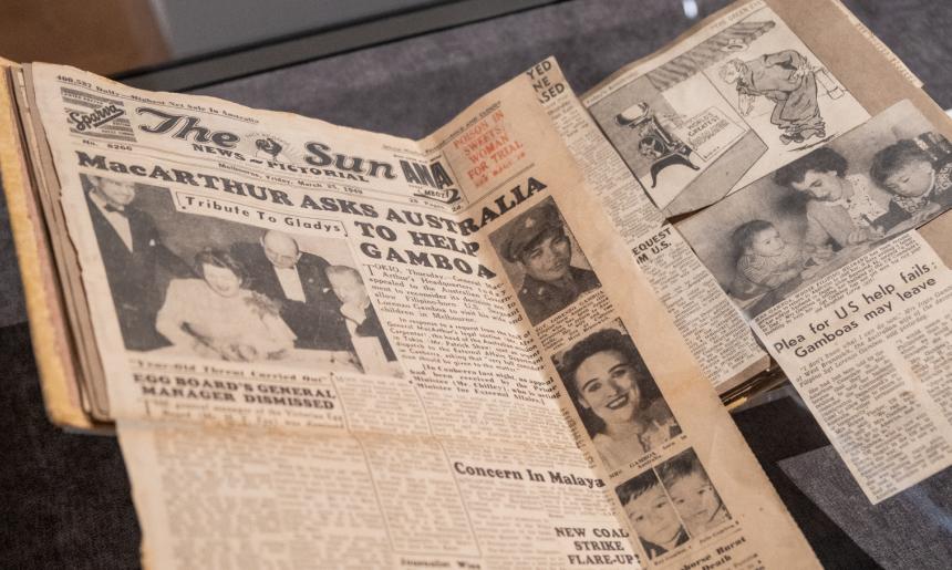 Scrapbook of newspaper clippings, including one full page and a cartoon, about the Gamboa family