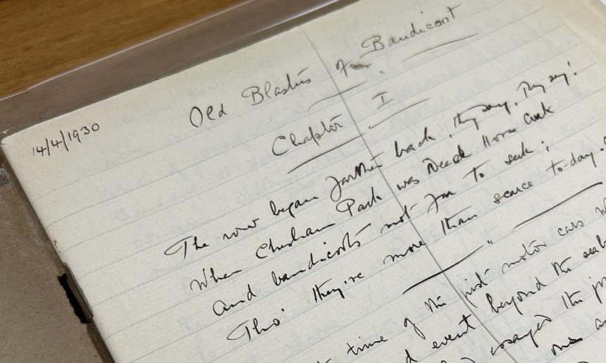 An open notebook with handwritten text in black ink