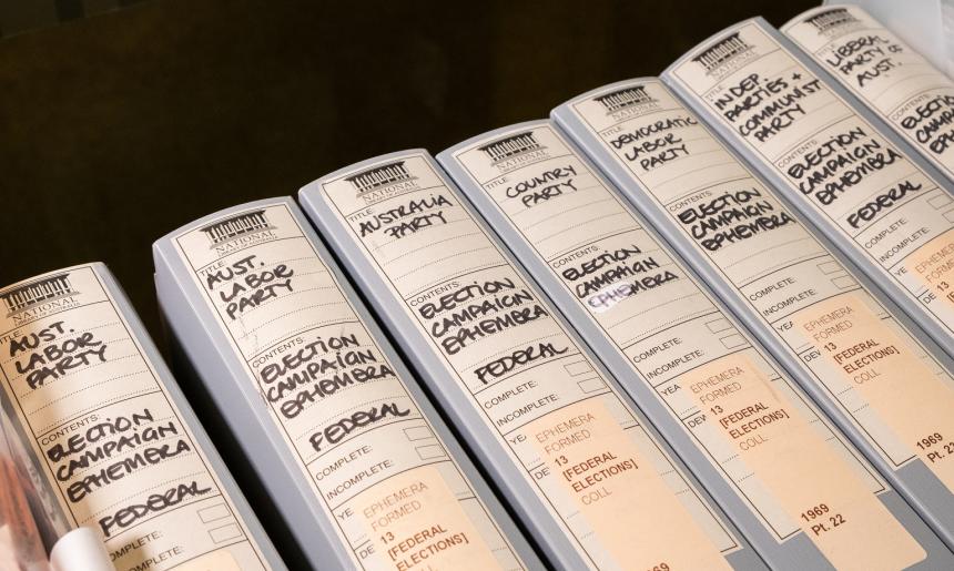 Folders containing ephemera from the 1969 Australian Federal election with labels on the spines for the corresponding political party