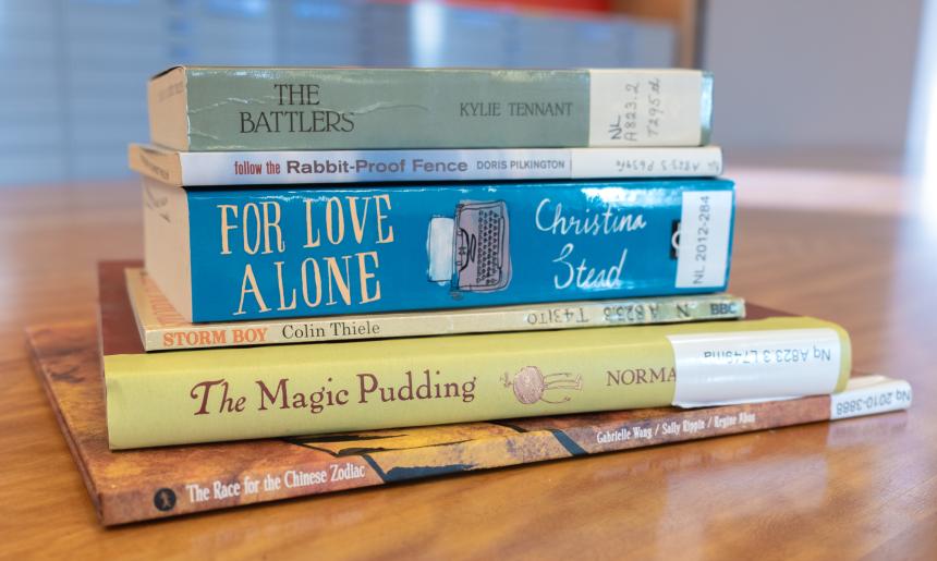 Pile of colourful books of different sizes by authors Kylie Tennant, Doris Pilkington, Christina Stead, Colin Thiele, Norman Lindsay and Gabrielle Wang