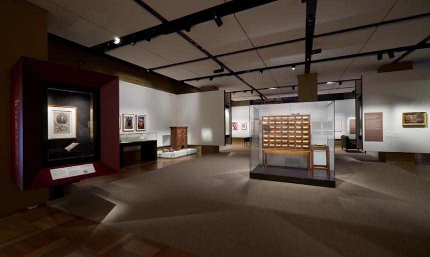 A photograph of the Library’s Treasures Gallery. The William Shakespeare display is on the left-hand side of the image. The Fred Ward card catalogue is on the right-hand side of the image.