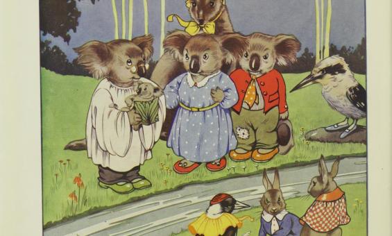 A colourful illustration featuring a group of anthropomorphic koalas dressed in clothes, along with other animals like rabbits and birds, gathered in a grassy area. A caption reads, "What shall I name this young bear?"