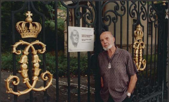 Man leaning against gate