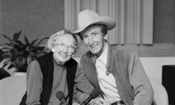 Black and white photo of Smoky and Dot Dawson sitting and smiling at the camera