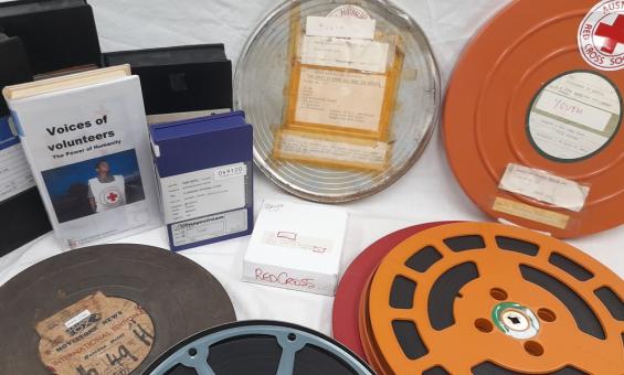 A selection of Australian Red Cross Society films in circular and rectangular cases.