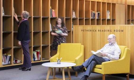 People sitting, reading and browsing material in the Petherick Reading Room