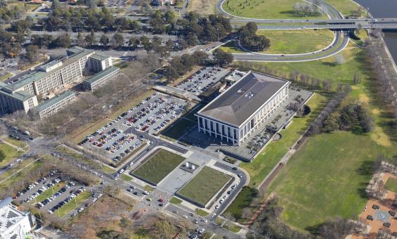 View of the Library building, carparks and nearby buildings and roads seen from a drone