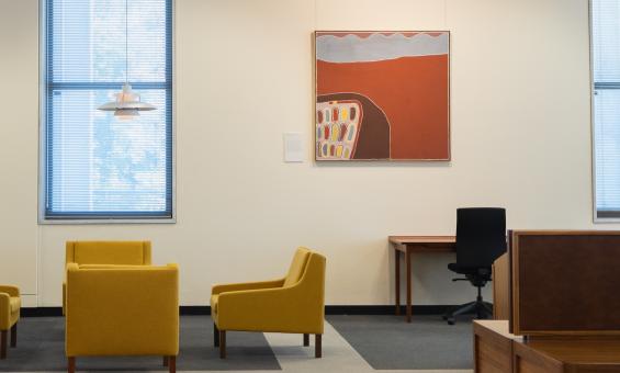 Orange, brown and white painting hung in the main reading room