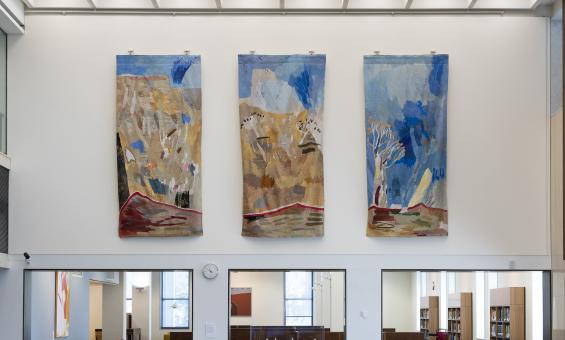 Three colourful tapestry panels depicting Australian landscapes hung in the main reading room