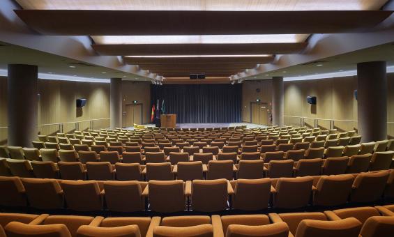Looking from the back of an empty theatre towards the stage
