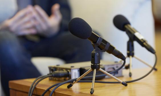 Two microphone on a table during an oral history interview
