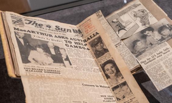 Scrapbook of newspaper clippings, including one full page and a cartoon, about the Gamboa family