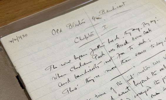 An open notebook with handwritten text in black ink