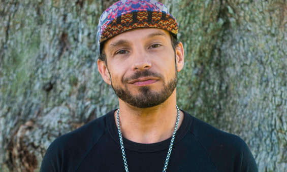 Scott-Patrick Mitchell standing in front of a tree