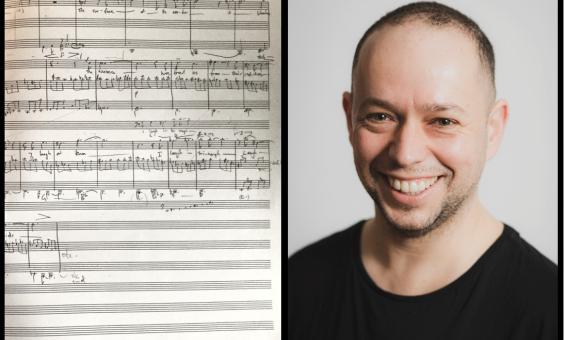 A page of handwritten music notations with composer Luke Styles wearing a black t-shirt