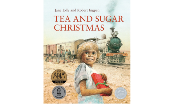 Cover for children's book 'Tea and Sugar Chrismas' featuring an illustration of a young child holding a wrapped christmas present standing and smiling in front of a train