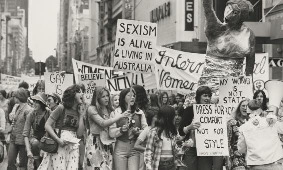 Women holding placards and protesting in the street