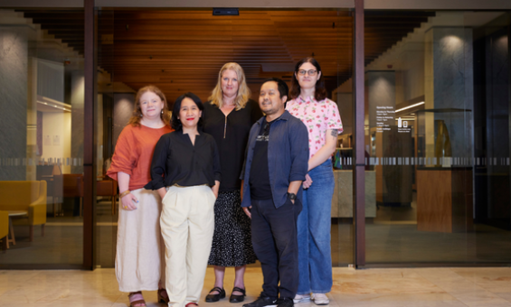 Five people standing in front of the Main Reading Room